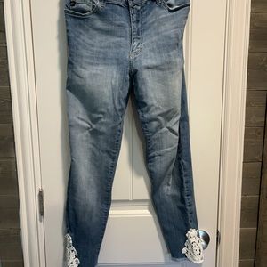 Distressed denim skinny leg jeans